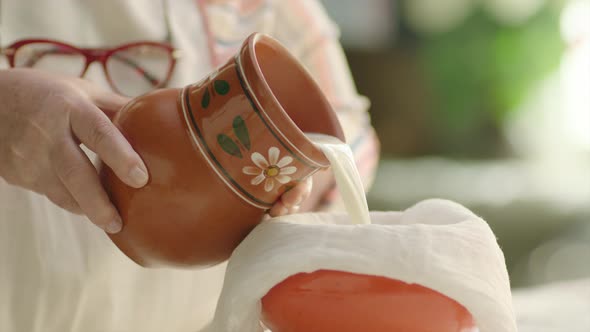 Pouring Milk Into the Glass From Crock in the Country alt