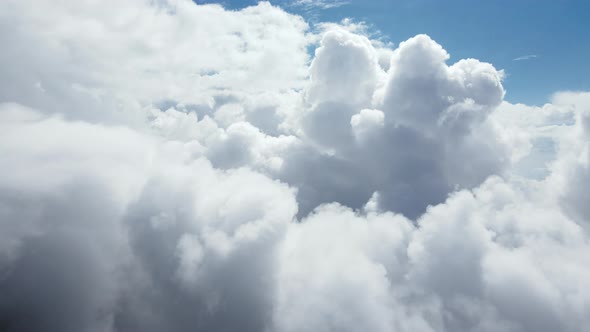 An Amazing View of Soft White Clouds Moving Slowly Across a Clear Blue Sky alt