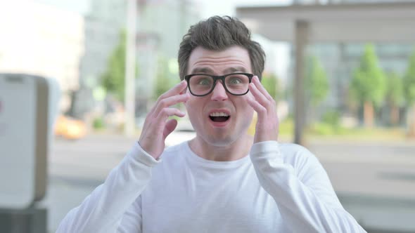 Portrait of Disappointed Young Man Reacting to Loss Outdoor alt