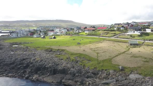 Faroe Islands Shoreline Town Panorama Filmed By Drone alt