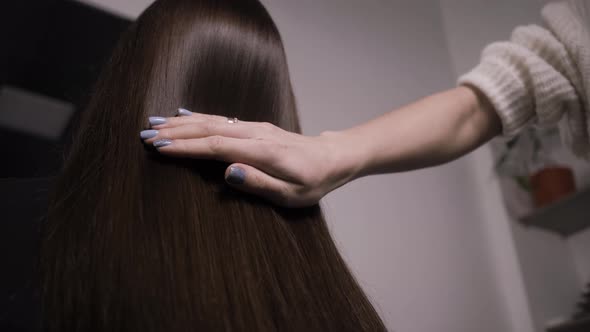 Demonstration of Smooth and Silky Hair After Straightening It with a Steampod alt