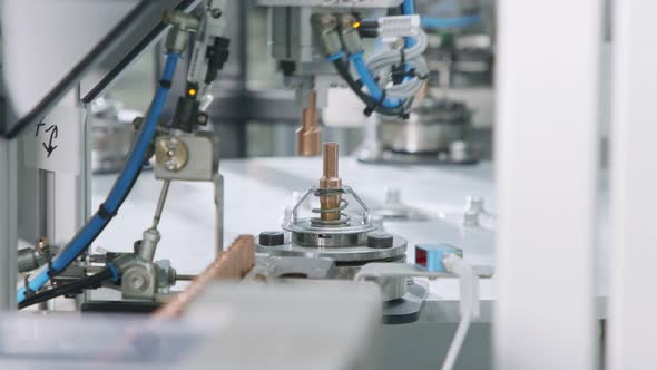 Advanced robotic machine manufacturing parts in an automated assembly line alt