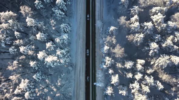 Cars Moving on Winter Asphalt Road Aerial Topview