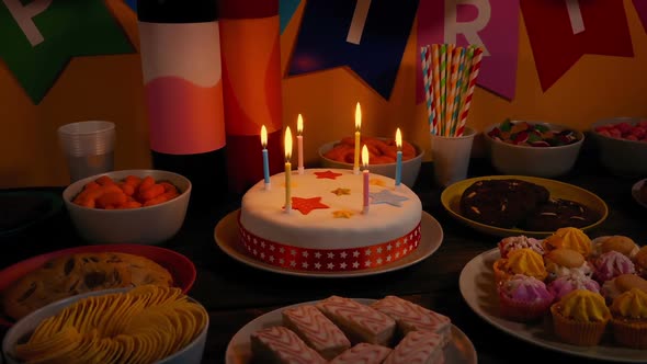 Kid's Birthday Party With Lit Cake Moving Shot alt