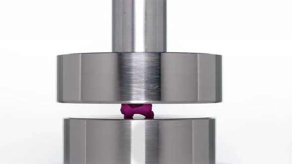 the Appearance of the Letter R When Lifting a Rod From a Hydraulic Press on a White Background alt