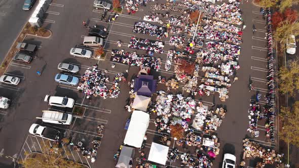 Aerial top-down panning of parking lot distribution center for Camp Fire evacuees in California alt