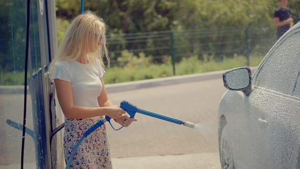 Car Washing.Car Self Service Washing.Car Soap Foam.Car Wash And Waxing Vehicle..Clean Water Spray alt