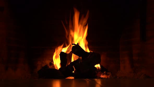 Plan of a fireplace where wood burns to make fire and heat the home, magic and hypnosis of the flame alt