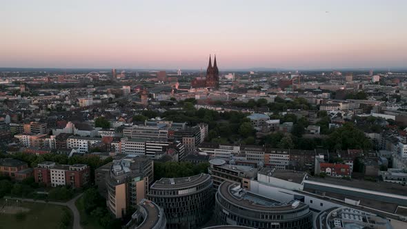 Cologne, Germany - Aerial bird view flight of the city panorama at sunset dipping the skyline and fa alt