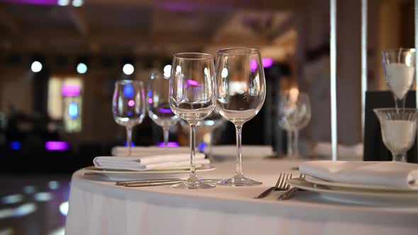 Empty Wine Glass on Table with White Tablecloth Serving for Guests