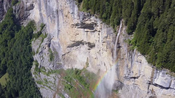 Aerial travel drone view of the Lauterbrunnen Valley and Staubbach Falls, Switzerland. alt