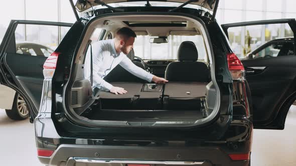 Man Choosing Vehicle in Showroom alt