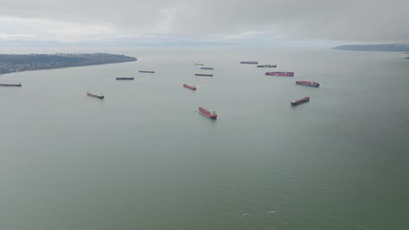 aerial footage of cargo ship backlog in the pacific ocean, Vancouver, British Columbia, Canada alt