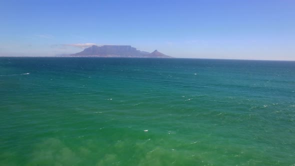 Aerial travel drone view of Table Mountain, Table Bay from Bloubergstrand, Cape Town, South Africa. alt