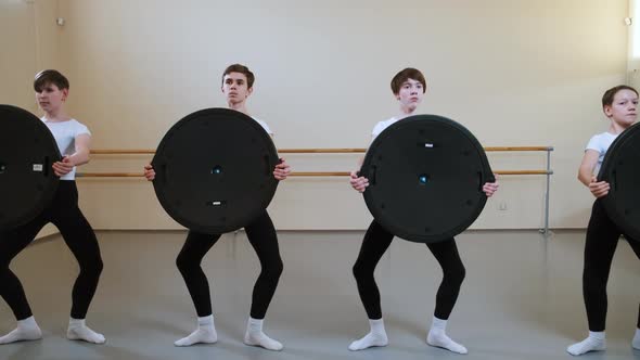 Group of Boys on Ballet Gymnastics Class Performing Exercise