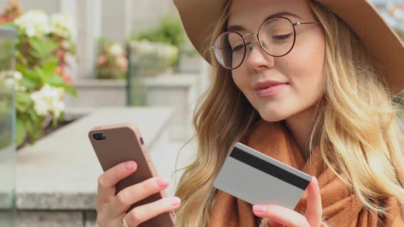 Young Girl Closeup Making Internet Order Using Phone Happy Woman Shopper Holding Telephone and alt