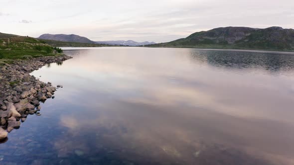 Drone Flying Over The Idyllic Lake In Hydalen, Hemsedal, Norway - low aerial alt