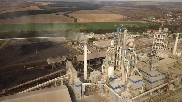 Aerial view of cement plant factory at industrial production area. alt