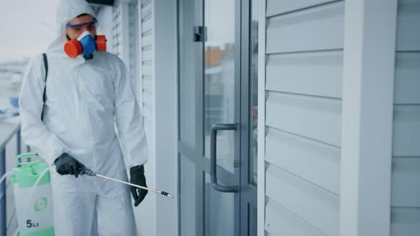 Corona Virus. Man White Protective Chemical Suit Disinfect. Covid-19 Coronavirus alt