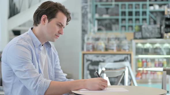 Creative Man Having Failure Writing on Paper alt