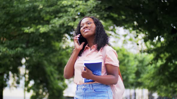 African Student Girl Calling on Smartphone in City alt