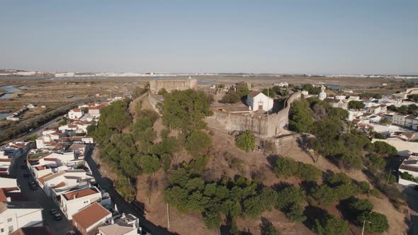 Church of Santiago inside Castro Marim hilltop medieval Castle, Algarve, Portugal.  Aerial view alt