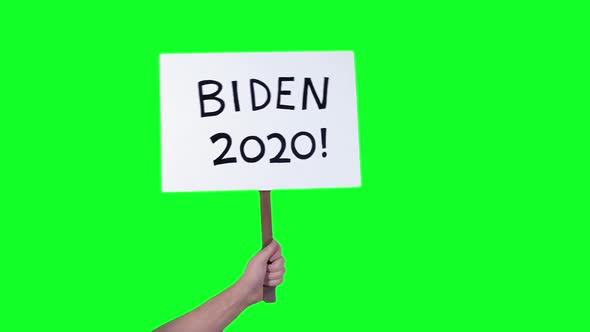 2020 Election Signs Held Up By Hand alt
