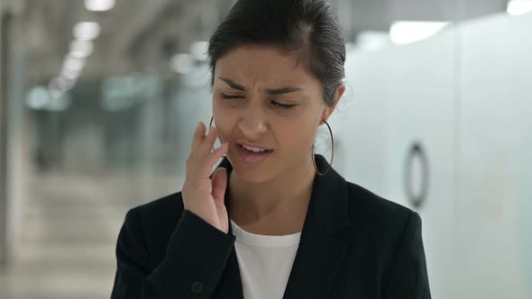Portrait of Sad Young Indian Businesswoman Having Toothache alt