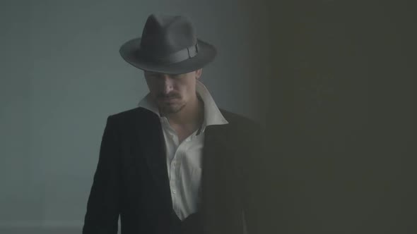 Portrait Confident Detective or Mafia Boss and Gangster Shooting with a Pistol. Weapons in the Hands alt