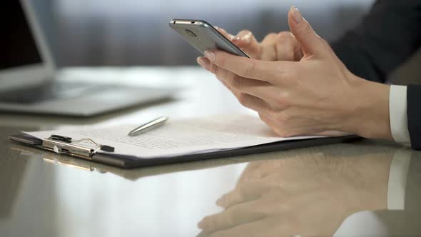 Lady Scrolling and Typing on Screen of Mobile Phone, New Calendar Appointment alt