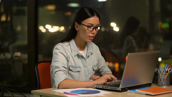 Woman Reading Mail on Laptop About Grant or Promotion, Successful Startup alt