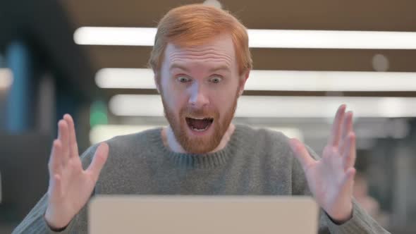 Portrait of Man Celebrating Success on Laptop alt