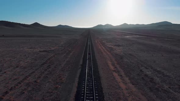 Aerial view of me walking alone on the train tracks in the Namib desert, Namibia - Africa