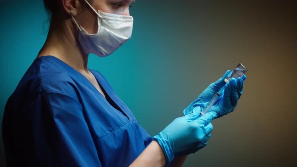 Doctor Filling Syringe with Solution alt