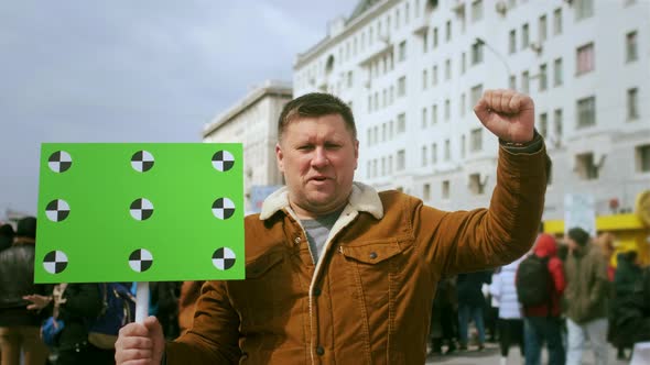 Empty Green Screen Mockup Banner with Tracking Points on Political Protest