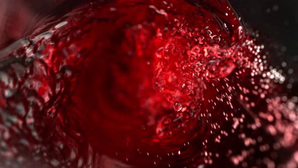 Super Slow Motion Abstract Shot of Red Wine Pouring in Glass Bottle at 1000 Fps alt