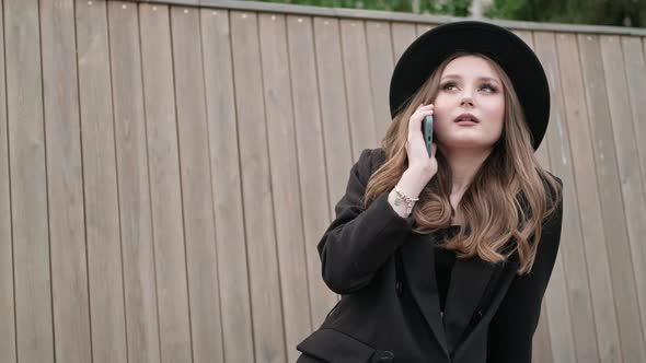 Young Stylish Attractive Woman Talking on the Phone alt