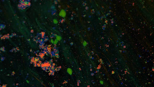 Marble Coloring Particles Move and Change on a Black Moving Background Transition alt