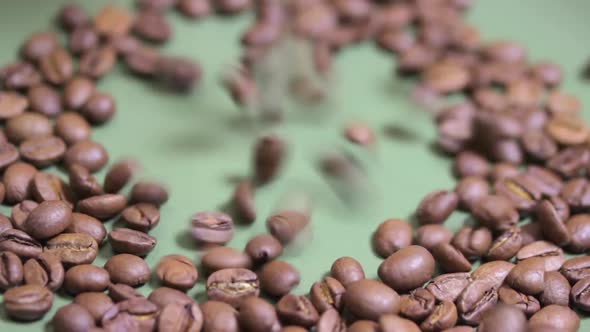 Macro Photography of Coffee Beans That Fall on a Plate