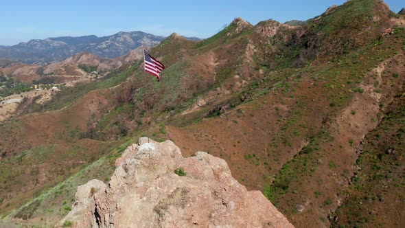 Beautiful Drone Shot Around of the USA Banner Set on Sunny Summer Day  alt