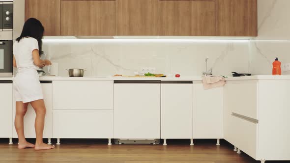 Woman Cooking Breakfast at Home