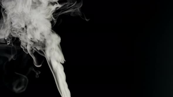 White smoke on a black background.