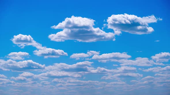 Timelapse of White Clouds Move and Dissolve in the Blue Sky Cloudy Space alt