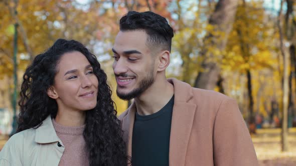 Closeup Happy Hispanic Couple on Date in Autumn Park Hug Partners Looking Each Other Woman Cuddle alt