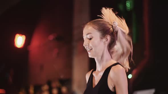 Slim Woman Training With Skipping Rope At Gym alt