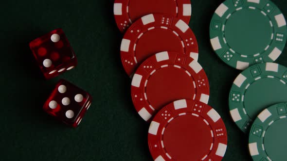 Rotating shot of poker cards and poker chips on a green felt surface - POKER 048 alt