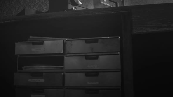 Retro room with vintage radio station standing on the desk under obsolete lamp. alt