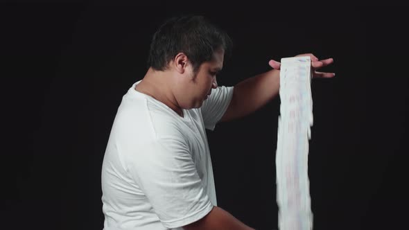 Asian Magician Starts Showing His Trick With Cards, Cards Cascading Down alt