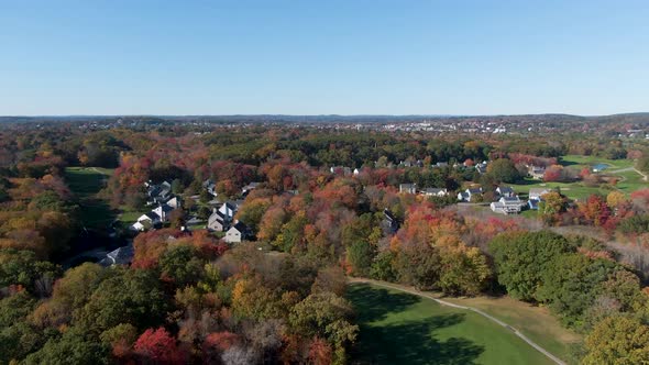 Township of Haverhill with autumn tree colors, drone ascend view alt