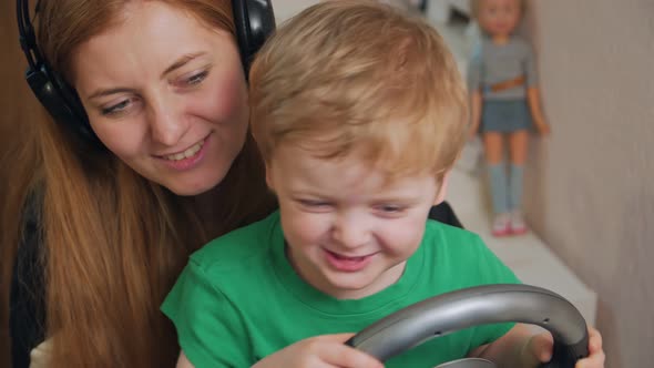 Closeup Boy And Woman Playing Racing alt